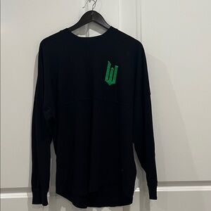Universal Studios.  WICKED Black Crewneck Sweater with Green Emblem
